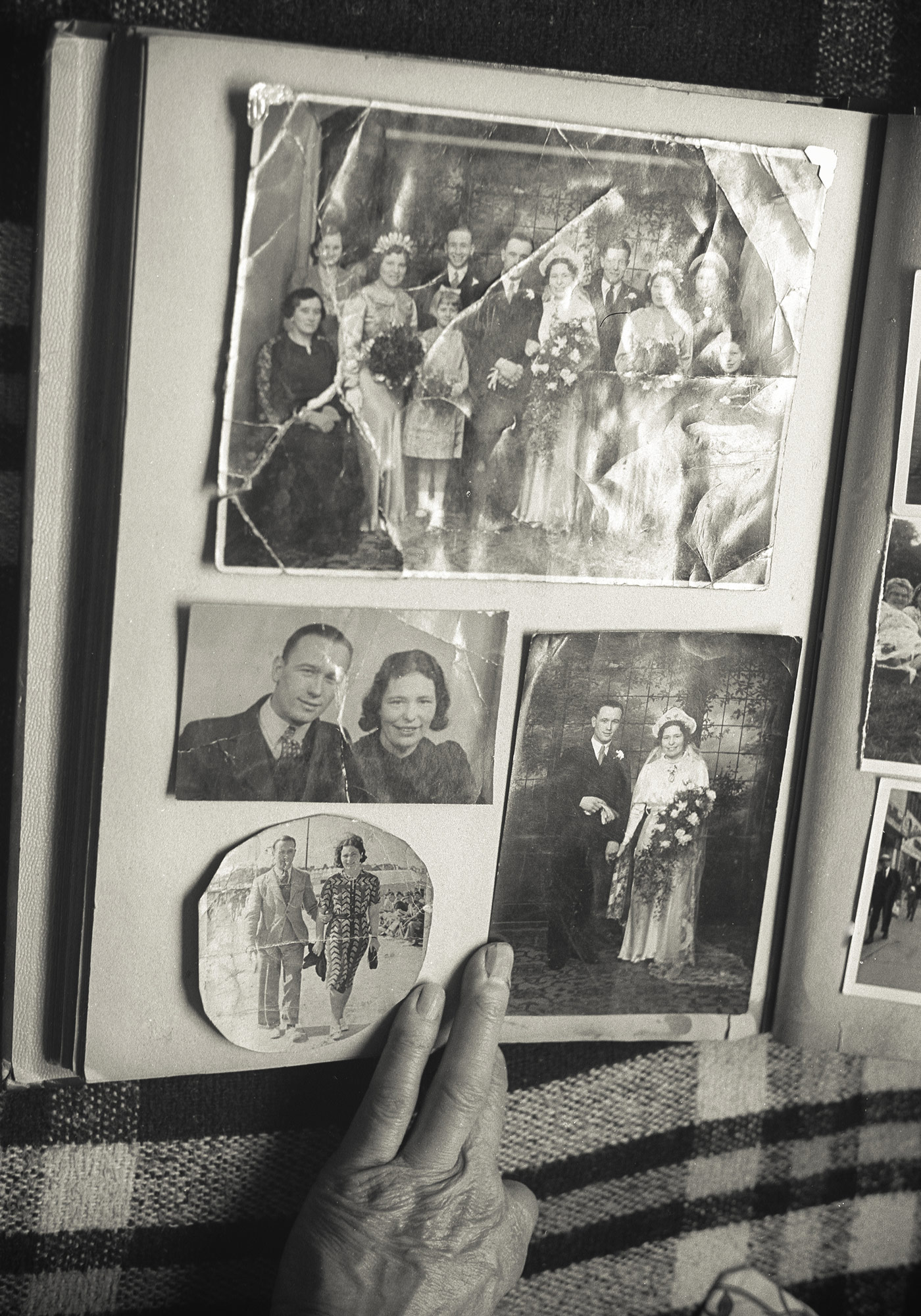 surrounded by albums and prints.